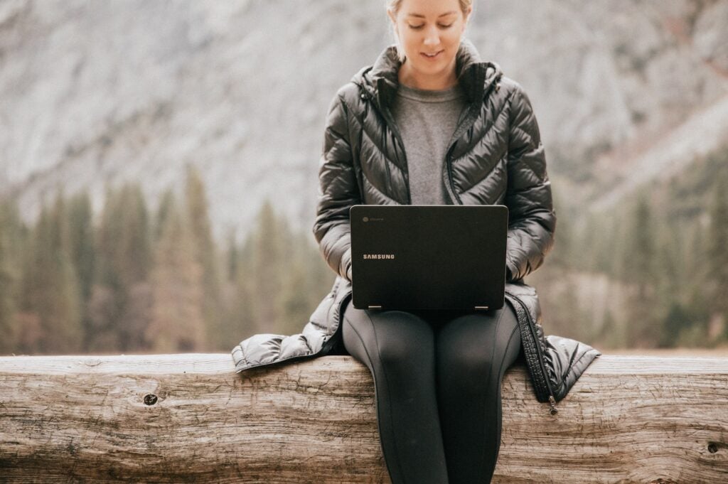 woman using laptop outside