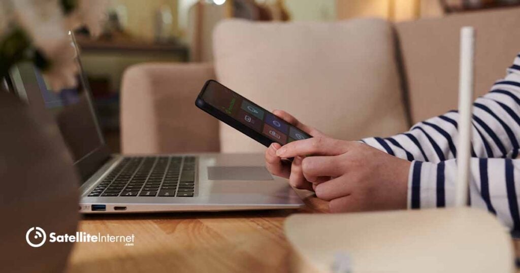 person using cell phone to set up wi-fi on device